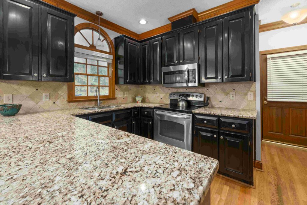 Cambria quartz countertops with elegant veining in a luxury modern kitchen with white cabinets